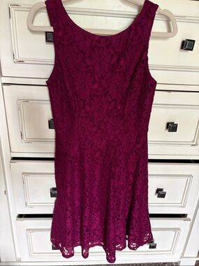 Macy’s Sleeveless Floral Lace Sleeveless Mini Dress in raspberry.